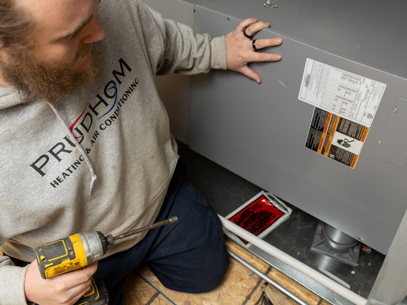 Men looking at a new furnace installation